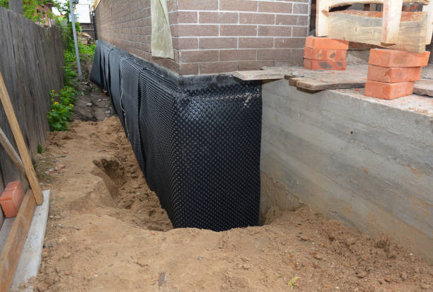 Happy homeowners after waterproofing job in New Ross